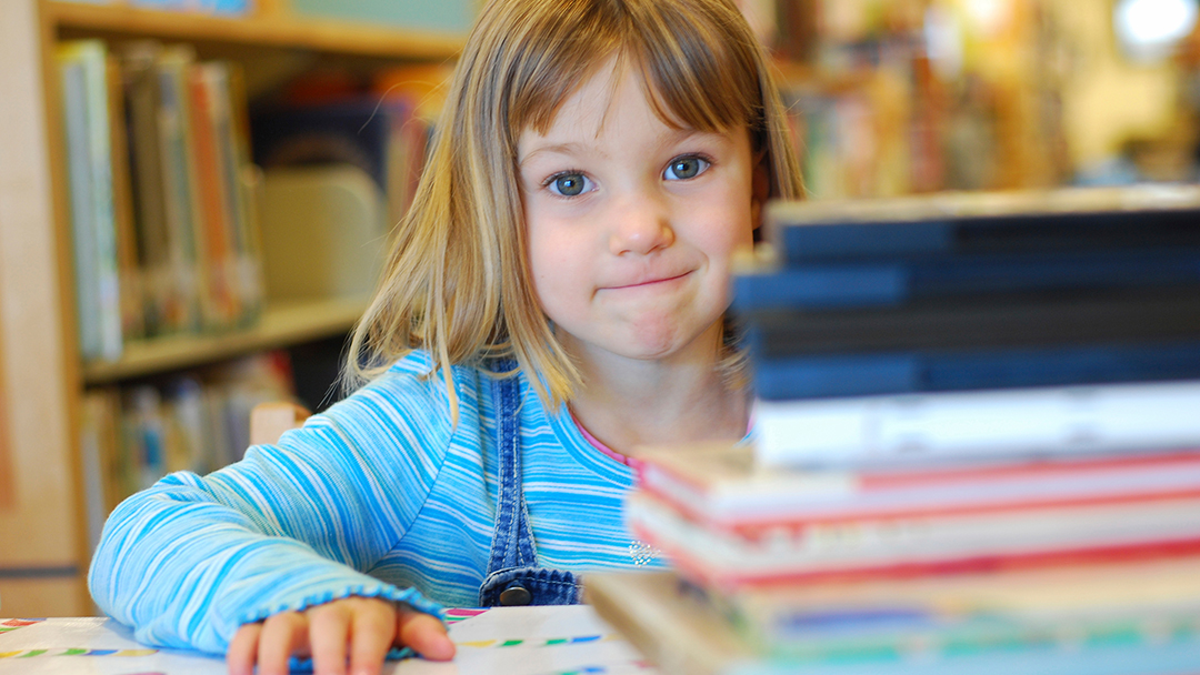 Hero girl with books